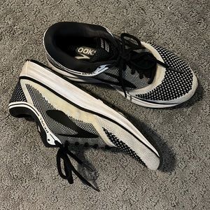 Brooks. Definitely have some wear but great walking/running shoes!